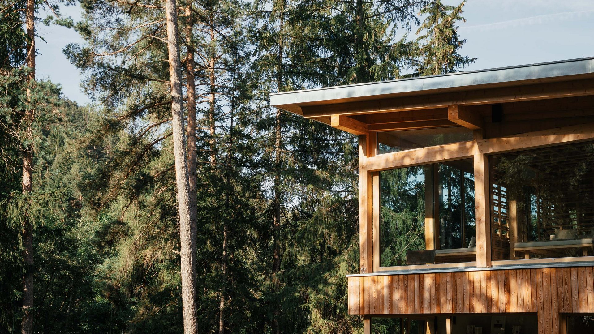 Sensoria Dolomites – Luxury for the Soul Modern wooden house with large windows in the forest