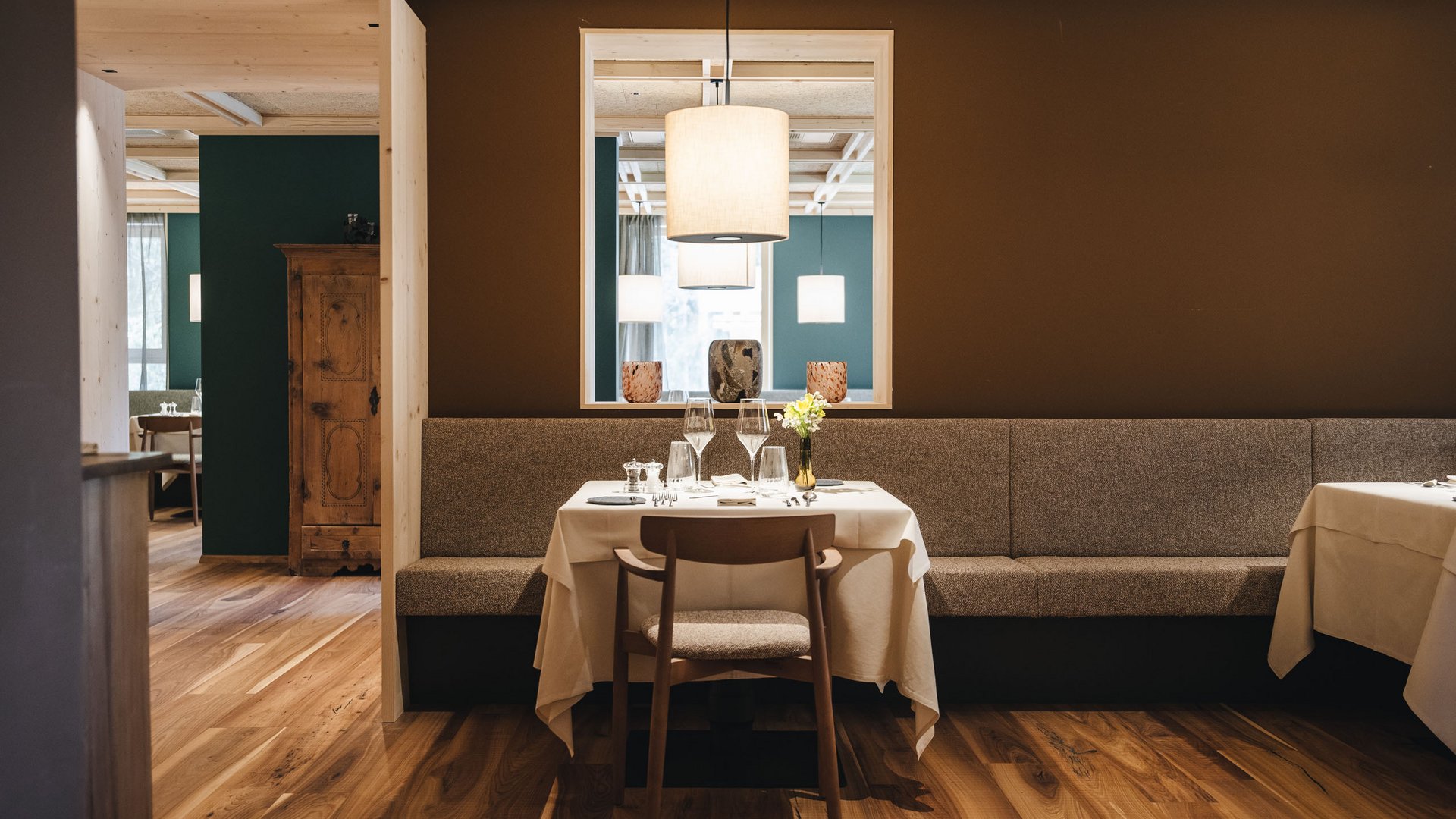 Sensoria Dolomites – Luxury for the Soul Elegant dining table with chair and lamps in modern restaurant