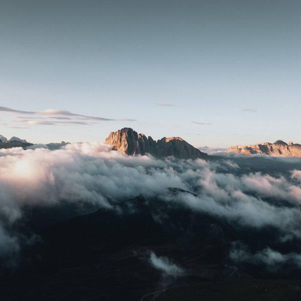 Sensoria Dolomites – Luxury for the Soul Mountain peaks above clouds at sunrise